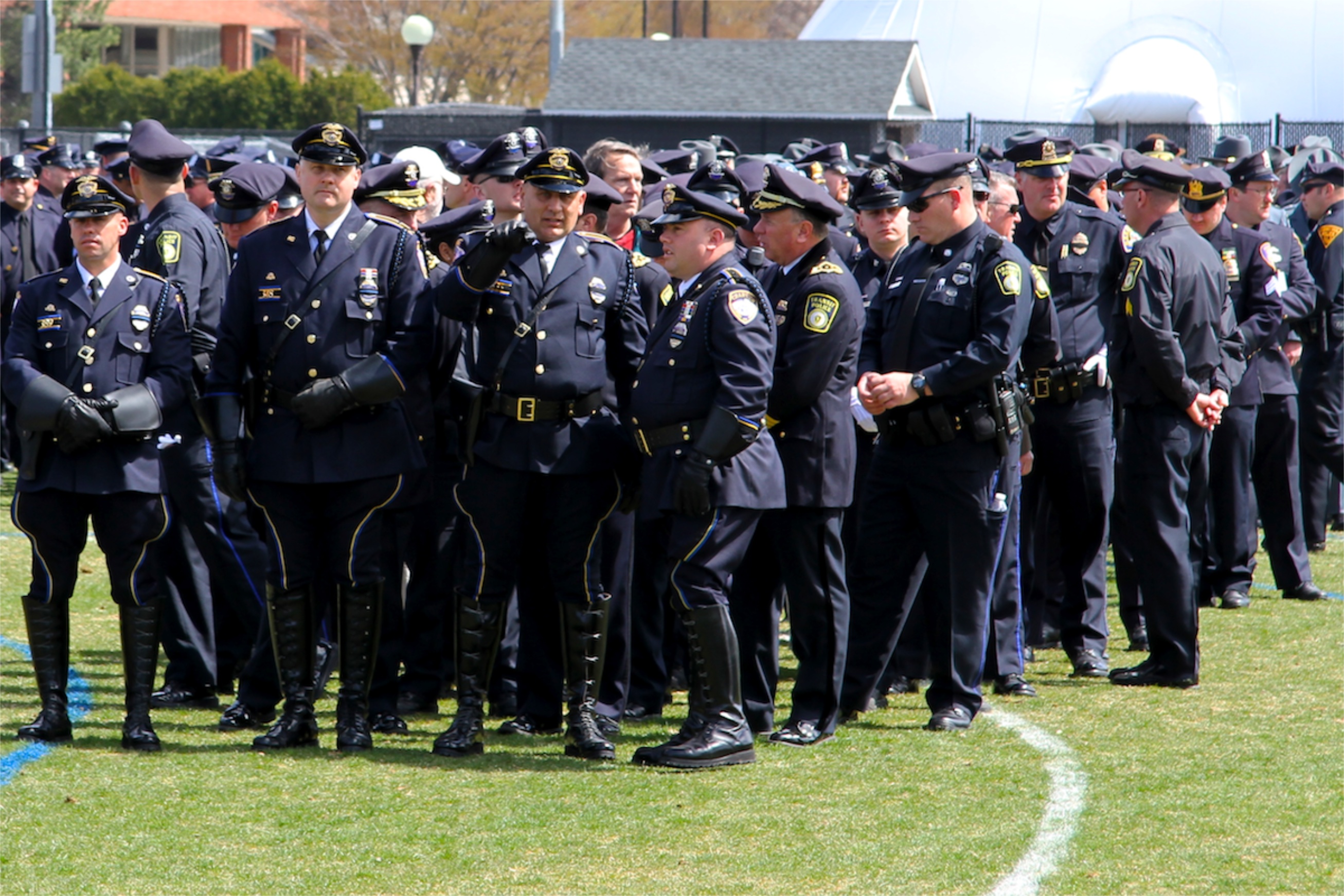 Boston area police officers attend Sean Collier's Memorial service on Briggs Field. Courtesy of Tamas Kolos-Lakatos.  
